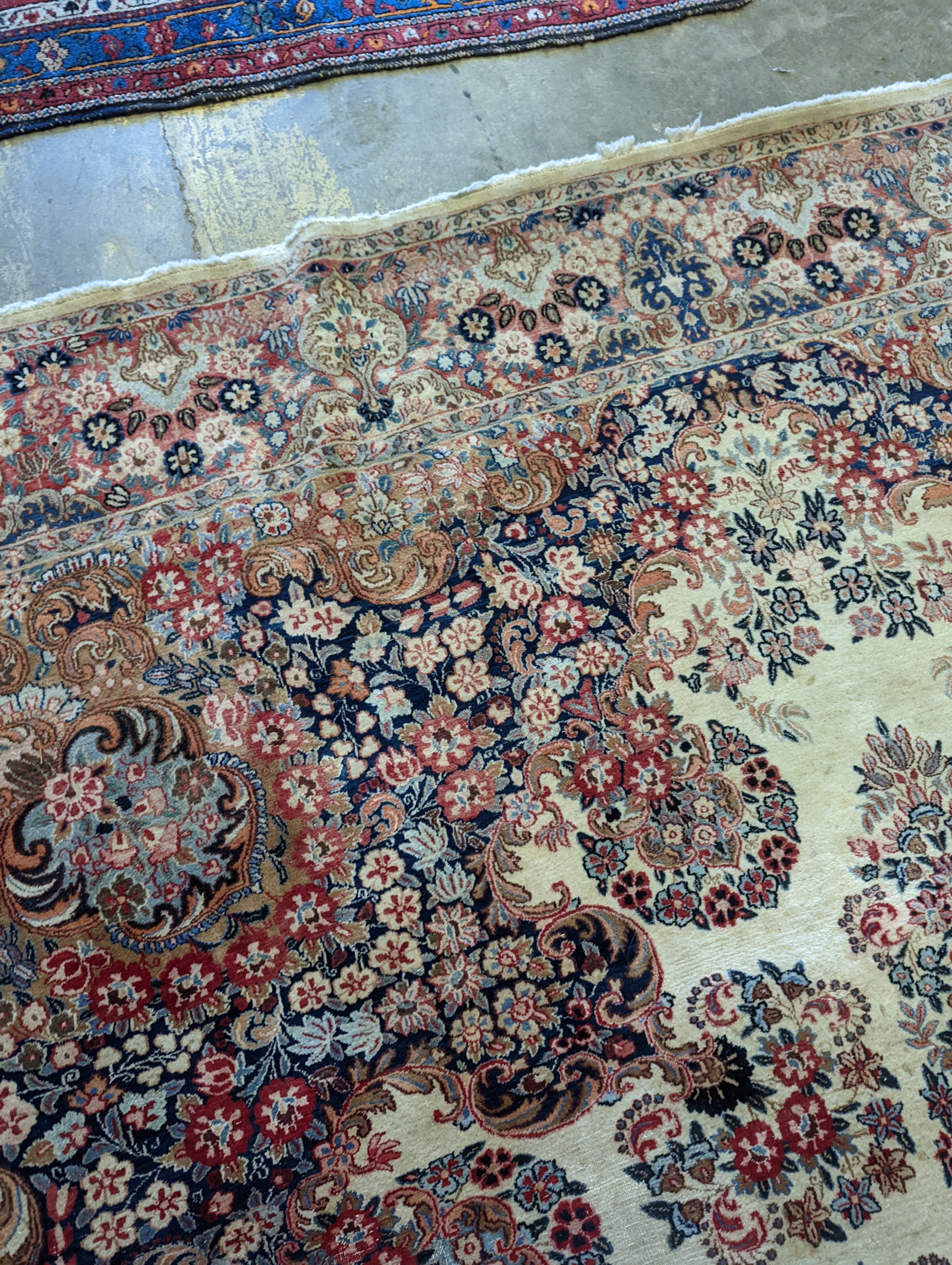 A North West Persian ivory ground carpet, 410 x 310cm